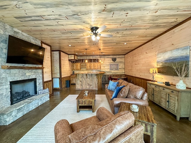 340 Hooch Holler Ln, Morganton, GA 30560 - living room featuring wood walls, concrete floors, wooden ceiling, ceiling fan, and a fireplace