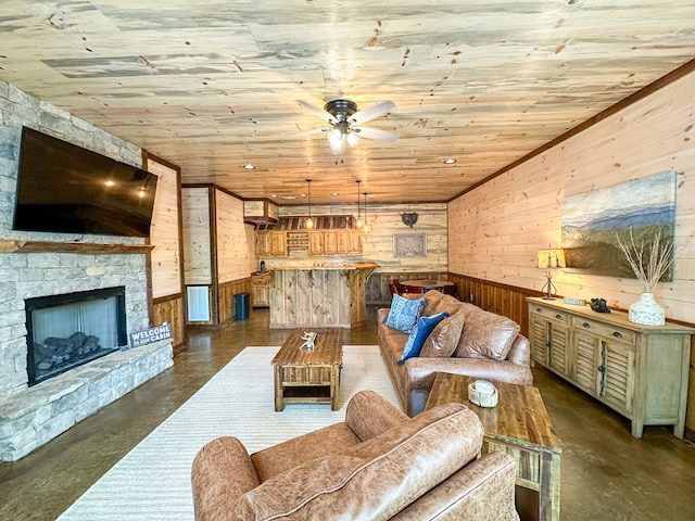340 Hooch Holler Ln, Morganton, GA 30560 - living room featuring wooden walls, concrete floors, ceiling fan, wood ceiling, and a fireplace