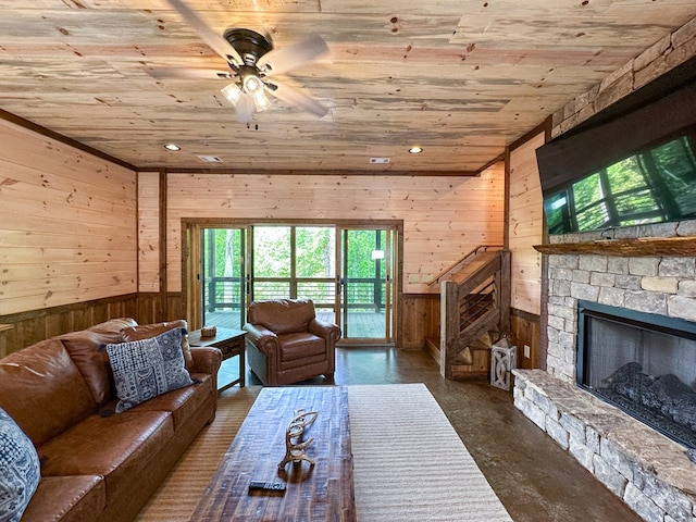 340 Hooch Holler Ln, Morganton, GA 30560 - living area featuring wood ceiling, wood walls, healthy amount of natural light, ceiling fan, and a stone fireplace