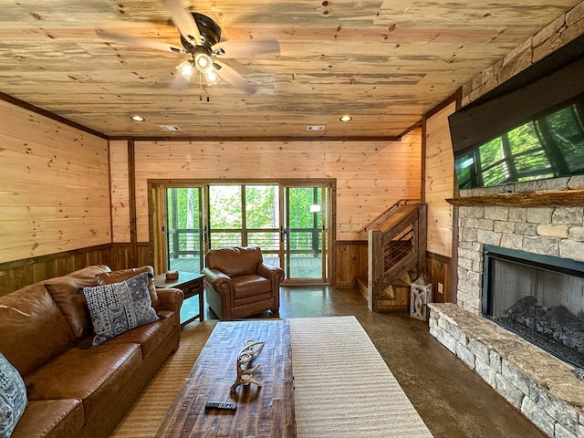 340 Hooch Holler Ln, Morganton, GA 30560 - living room with wood ceiling, wood walls, healthy amount of natural light, a ceiling fan, and a fireplace