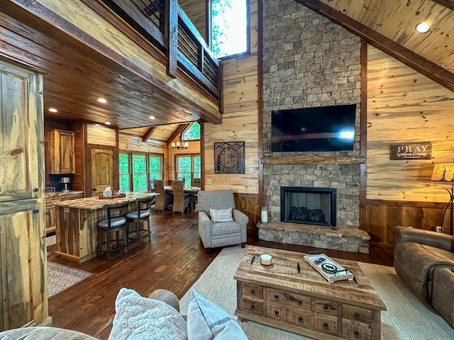 340 Hooch Holler Ln, Morganton, GA 30560 - living room with wood walls, high vaulted ceiling, dark wood-style flooring, wood ceiling with exposed beams, and a fireplace