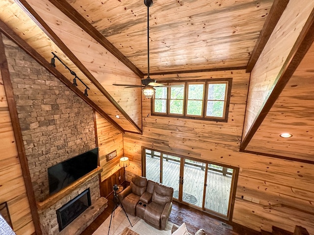 340 Hooch Holler Ln, Morganton, GA 30560 - living area with wooden ceiling, a fireplace, a ceiling fan, wood walls, and vaulted ceiling