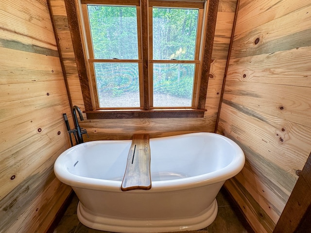 340 Hooch Holler Ln, Morganton, GA 30560 - full bathroom with wooden walls, a freestanding tub, and plenty of natural light