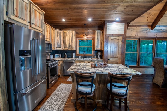 340 Hooch Holler Ln, Morganton, GA 30560 - kitchen featuring appliances with stainless steel finishes, wood ceiling, light stone countertops, a sink, and a center island