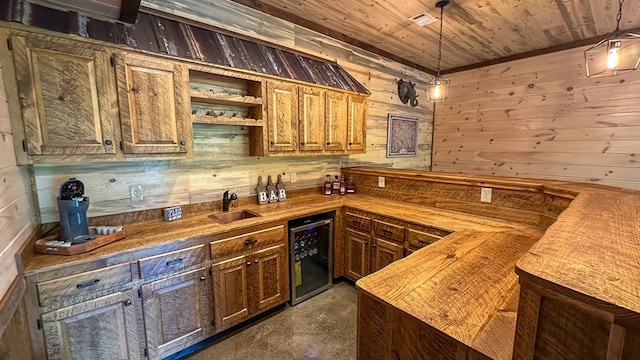 340 Hooch Holler Ln, Morganton, GA 30560 - indoor wet bar with wine cooler, wood walls, wooden ceiling, hanging light fixtures, and concrete flooring