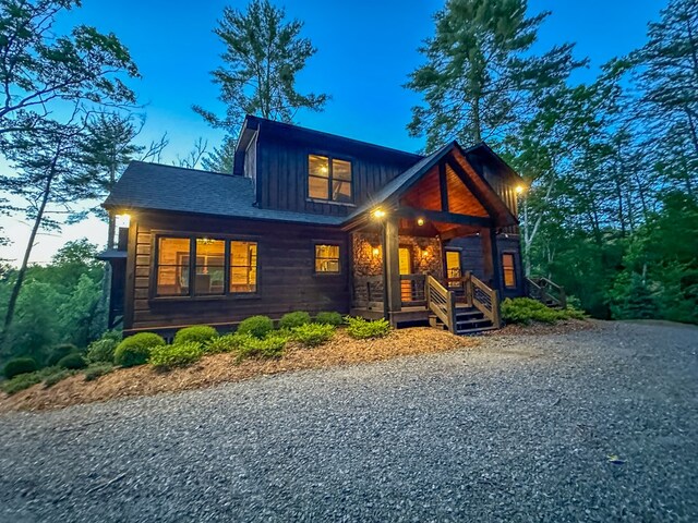 340 Hooch Holler Ln, Morganton, GA 30560 - view of front facade with board and batten siding and a porch