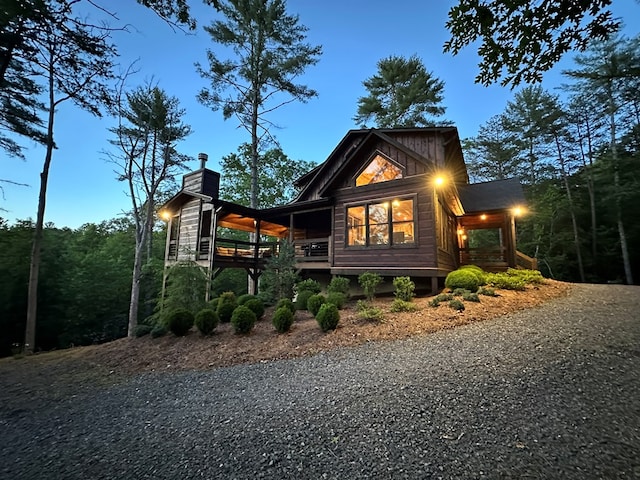 340 Hooch Holler Ln, Morganton, GA 30560 - view of side of home featuring gravel driveway and a chimney