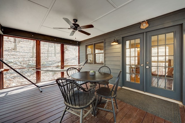 sunroom / solarium with french doors and ceiling fan