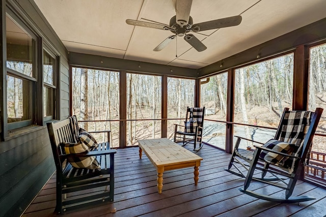 sunroom / solarium featuring ceiling fan