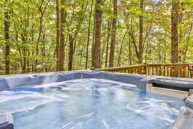 view of pool with a wooden deck