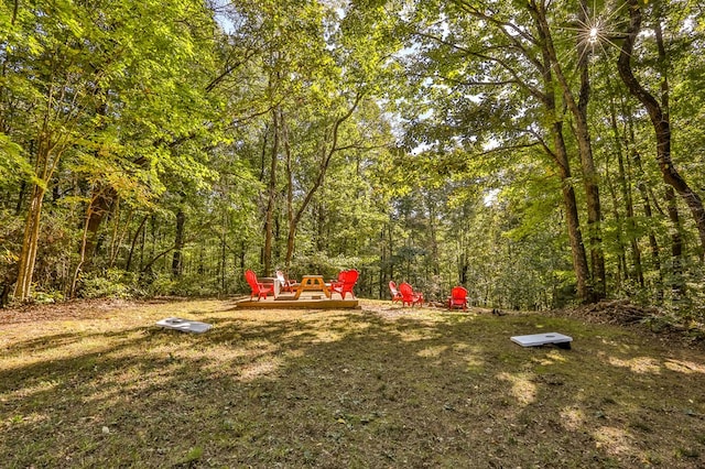 view of yard with a wooded view