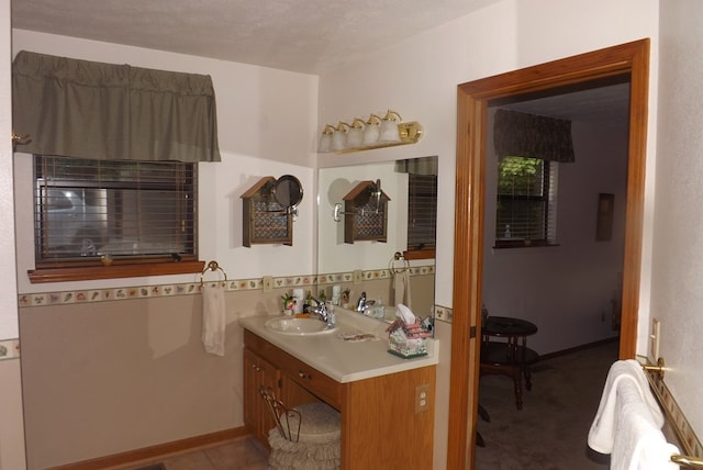 bathroom featuring vanity and a textured ceiling