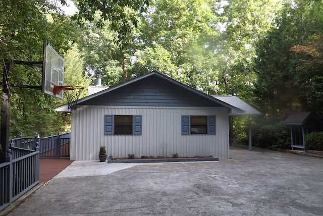 view of property exterior with a deck