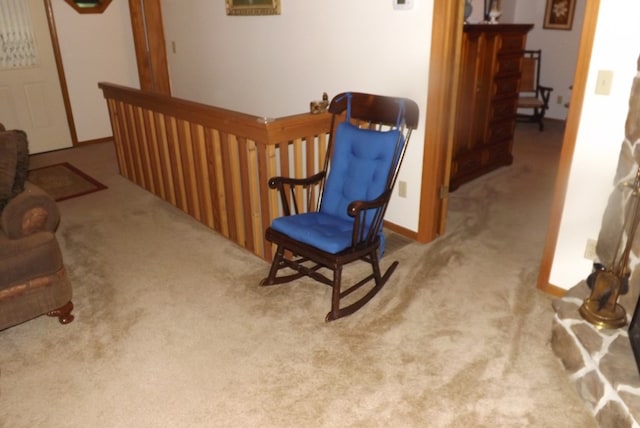 living area with light carpet