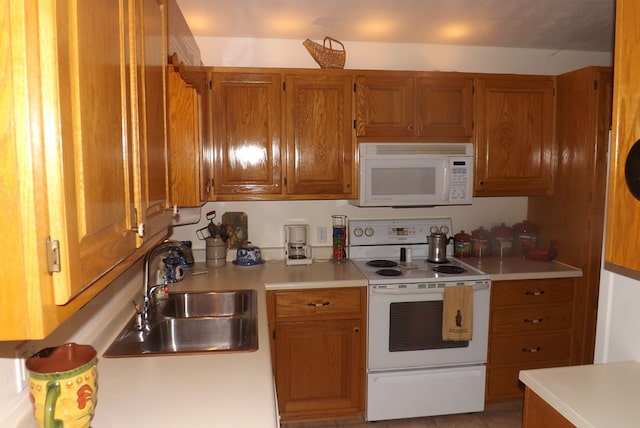 kitchen with sink and white appliances