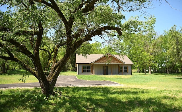 view of home's community with a yard