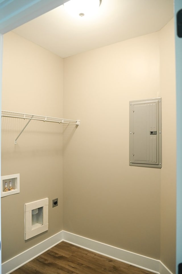 laundry area featuring electric dryer hookup, hookup for a washing machine, and dark wood-type flooring