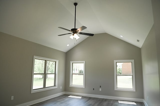 unfurnished room with dark hardwood / wood-style floors, high vaulted ceiling, and ceiling fan