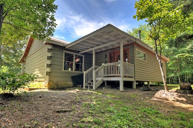 view of front facade featuring covered porch and metal roof