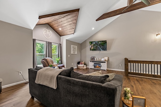 living room with lofted ceiling with beams and hardwood / wood-style floors