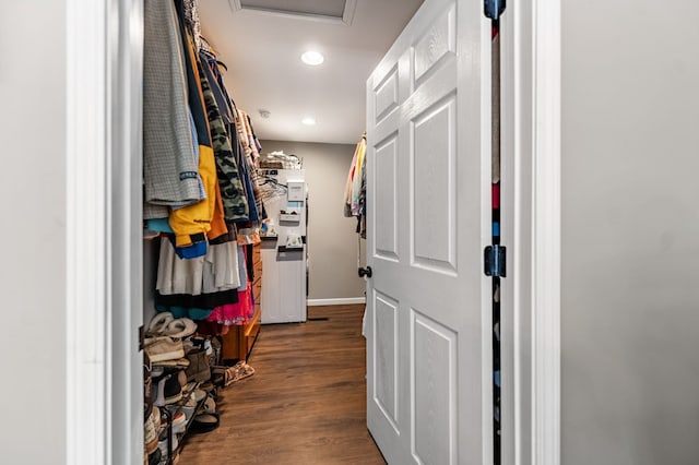 spacious closet with dark wood-type flooring