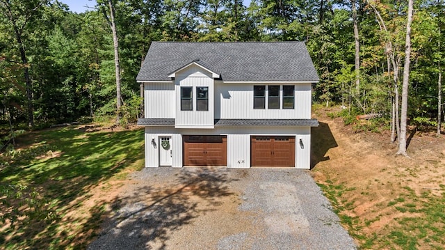 view of front of property featuring a garage and a front yard