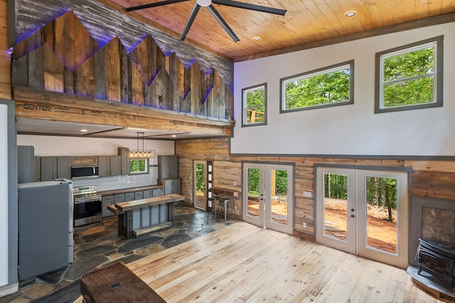 43 Old Federal Rd, Talking Rock, GA 30175 - living room featuring a towering ceiling, wood ceiling, french doors, hardwood / wood-style floors, and healthy amount of natural light