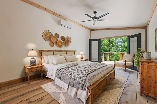 43 Old Federal Rd, Talking Rock, GA 30175 - bedroom featuring a wall mounted AC, light wood-type flooring, ceiling fan, baseboards, and vaulted ceiling