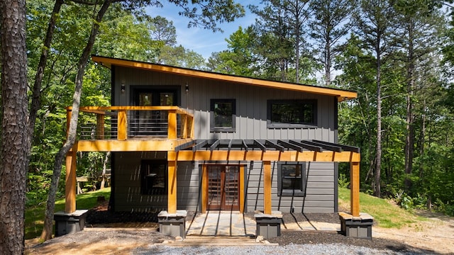 43 Old Federal Rd, Talking Rock, GA 30175 - view of front of house featuring french doors, a balcony, board and batten siding, and a pergola