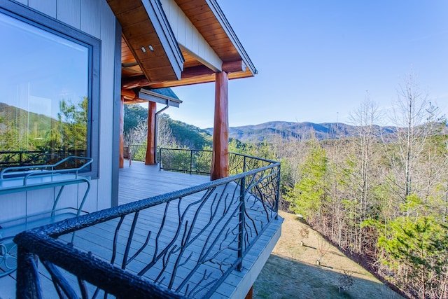 exterior space with a mountain view and a balcony