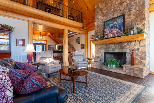 living room featuring high vaulted ceiling, a fireplace, a notable chandelier, dark hardwood / wood-style flooring, and wood ceiling