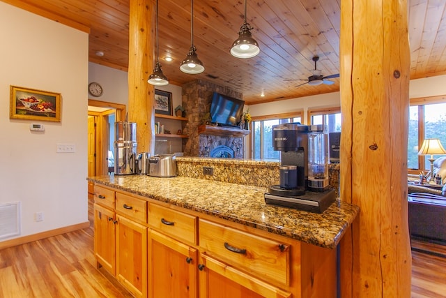 kitchen featuring decorative light fixtures, light hardwood / wood-style floors, stone countertops, and wood ceiling