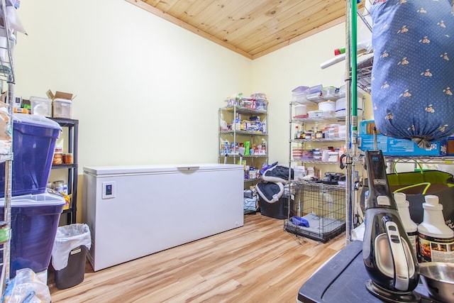 interior space featuring light wood-type flooring and wood ceiling