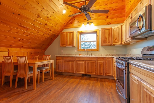 kitchen with lofted ceiling, sink, dark hardwood / wood-style floors, appliances with stainless steel finishes, and wood ceiling