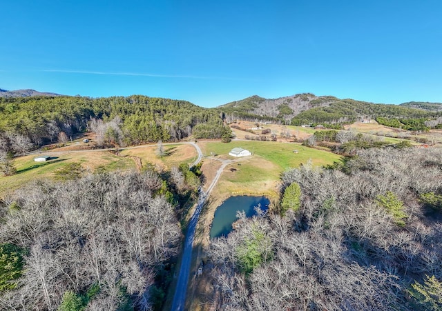 drone / aerial view featuring a water and mountain view