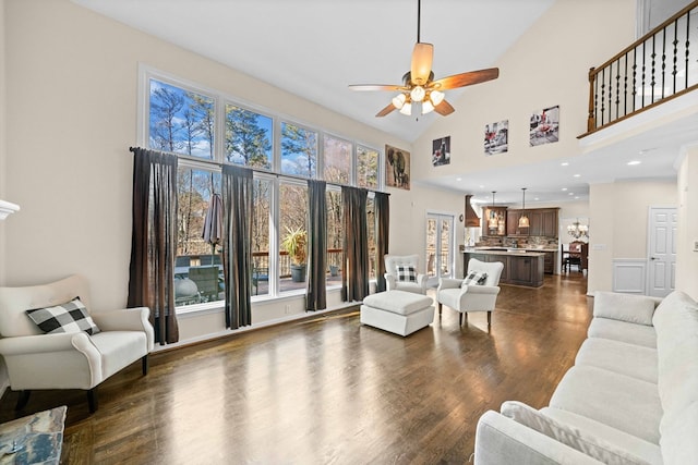 735 Amberton Close, Suwanee, GA 30024 - living room with a ceiling fan, a high ceiling, and dark wood finished floors