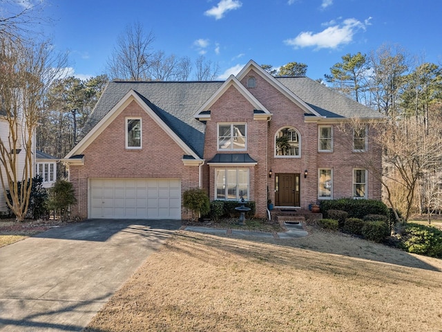 735 Amberton Close, Suwanee, GA 30024 - traditional-style house with brick siding, concrete driveway, a garage, and roof with shingles