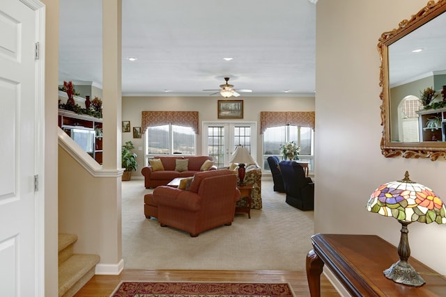 living room with ornamental molding, ceiling fan, and hardwood / wood-style floors