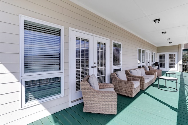 deck with french doors and an outdoor living space