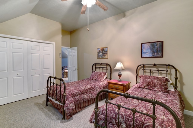 bedroom featuring light carpet, ceiling fan, vaulted ceiling, and a closet