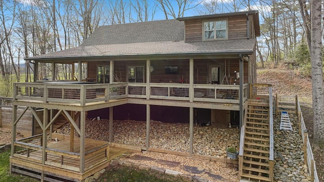 back of house with a wooden deck