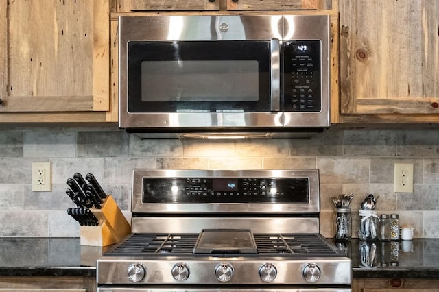 kitchen featuring appliances with stainless steel finishes and tasteful backsplash