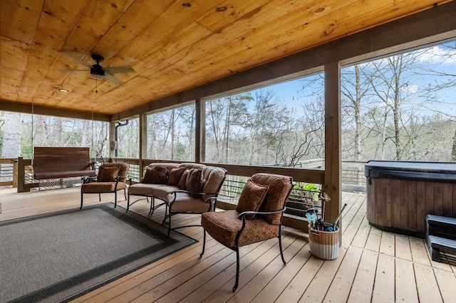 sunroom / solarium with wooden ceiling and ceiling fan