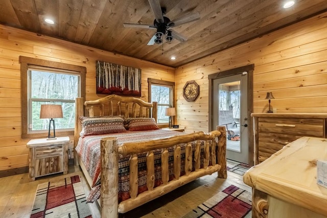 bedroom with wood ceiling, light hardwood / wood-style floors, and ceiling fan