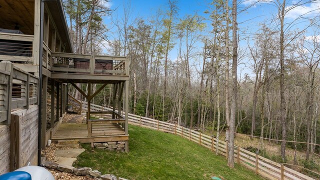 view of yard with a wooden deck