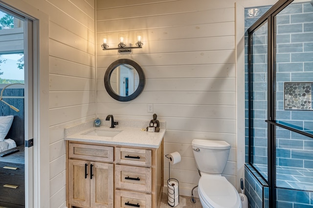 full bathroom with wooden walls, toilet, a shower with door, and vanity