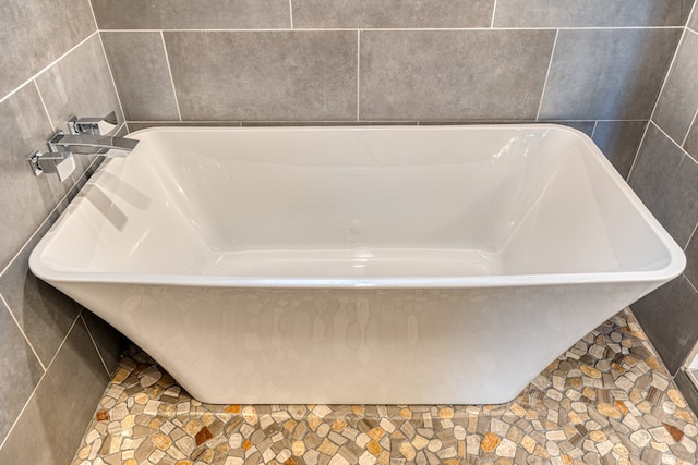 interior details featuring a freestanding bath