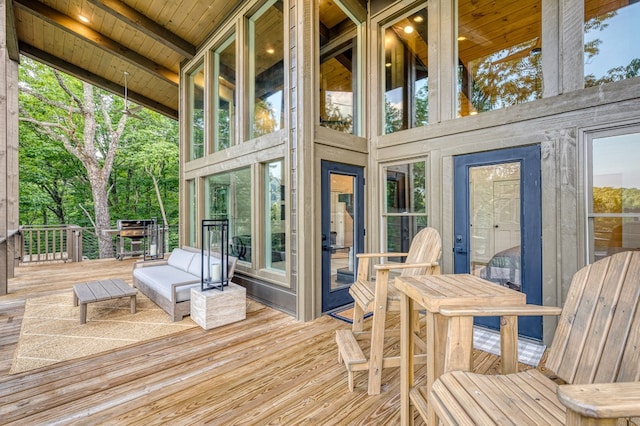 sunroom / solarium with beamed ceiling