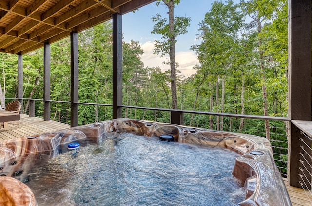wooden terrace with a hot tub