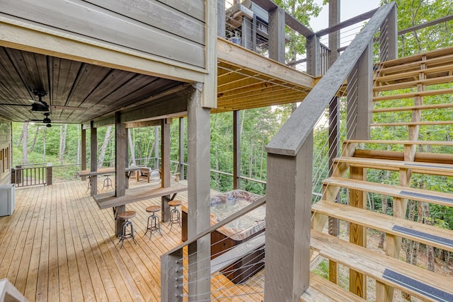 wooden terrace with stairs and ceiling fan